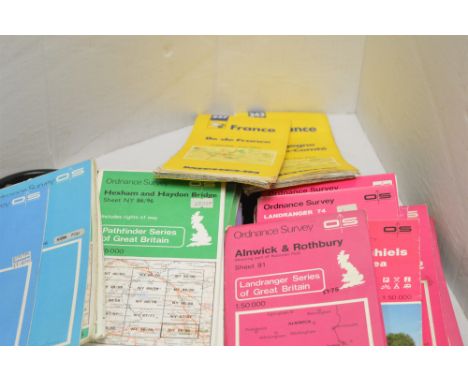 A tray of Ordnance Survey maps and road maps; together with measuring devices.