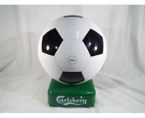 A Carlsberg Soccer Cule beer fridge, portable 240v AC/12, v DC mini chiller / heater HUS - HM5, complete with leads, car char