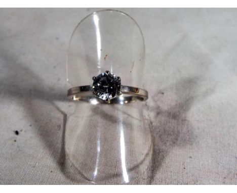 A lady's hallmarked 9ct white gold cz solitaire ring, approx 1.8 grams, size O1/2, boxed