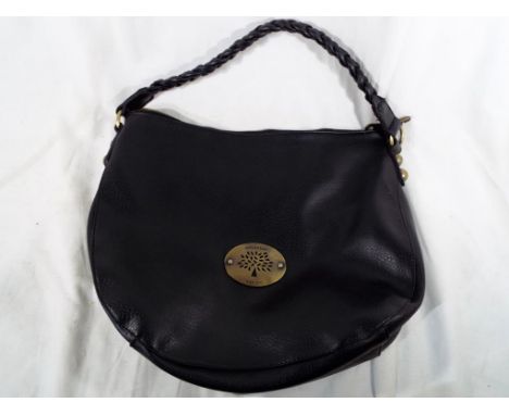 A good quality handbag marked Mulberry, Est 1971 on a brushed yellow metal plate, button stoppers displaying logo, zip and fu