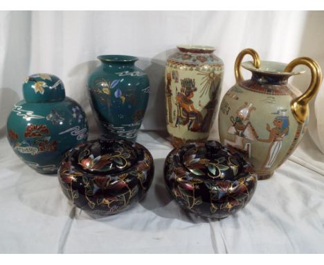 A matched pair of two lidded pots with a floral decoration and gilded highlights 17cm, a large ceramic vase 31cm with matchin