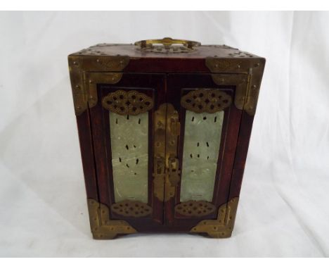 A good quality Chinese wooden jewellery box with brass detailing inset with pierced jade decoration, Est £20 - £40