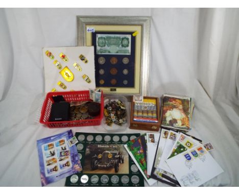 A good mixed lot to include a quantity of postcards, mint stamps, classic car tokens, UK and foreign coins, a quantity of ena