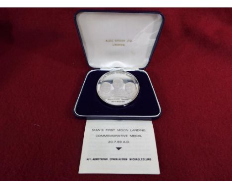 A silver Man's First Moon landing commemorative medallion / medal No. 1756 marked to the rim, issued in a limited edition of 