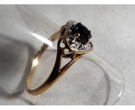 A lady's hallmarked 9ct gold ring with sapphire and diamond heart shaped cluster, approx 1.7 grams, size P, boxed