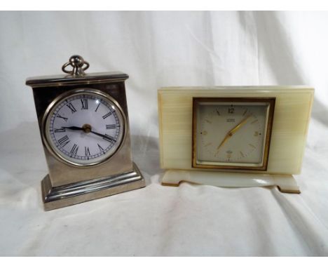 A good quality white metal mantle clock and an onyx mantle clock marked on the dial Fattorini Bradford, an Elliot clock with 