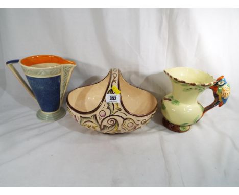 A Myott and Sons art deco style vase, a Wade Heath jug and a Wade ceramic basket decorated in the Gothic pattern (3). Estimat