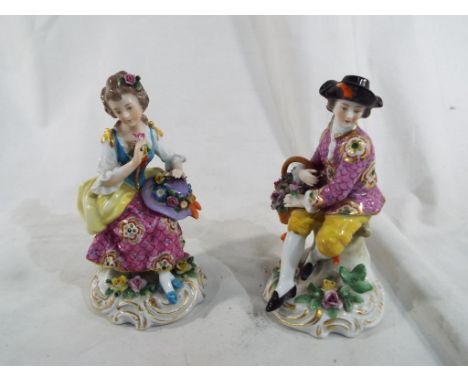 A pair of ceramic figurines in the style of Dresden Est £20 - £40