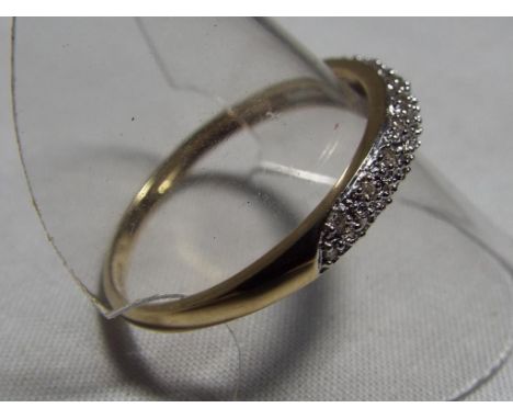 A lady’s hallmarked 9ct gold diamond band ring, appox weight 1.7 grams, size V, boxed. Est £25 - £40.