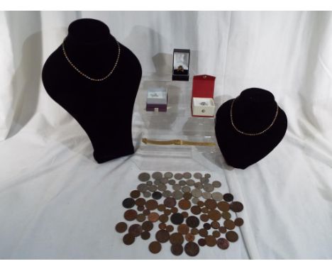 A good mixed lot to include two silver and cubic zirconia rings, one fashion ring, a lady's yellow metal wristwatch by Talis,