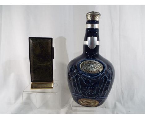 A ceramic Royal Salute Scotch whisky bottle 23 cm (h) and a Sarome rectangular table lighter 12.5 cm (h) (2)