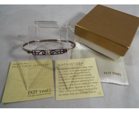 Charles Rennie McIntosh - a white metal Past Times art nouveau style bangle designed by Charles Rennie McIntosh, boxed with l