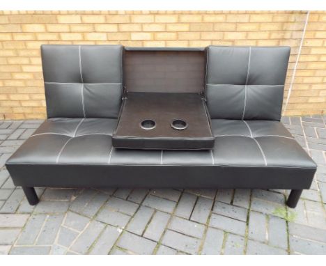 A black faux leather cinema sofa bed 90 cm x 179 cm, depth of sofa including back 90 cm