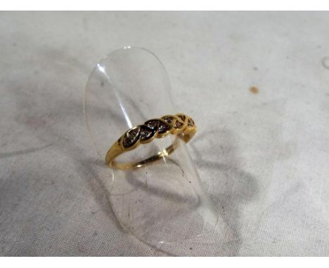 A lady's hallmarked 9ct gold and diamond band ring, approx 1.5 grams, size M1/2, boxed