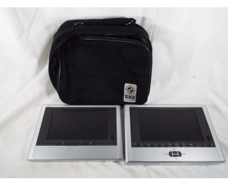 A Vision Liberty Twin entertainment on the go universal vehicle multi media system DVD CD and MP3 player, boxed with operatin