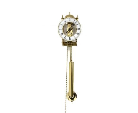 Hermle brass skeleton weight driven wall clock, eight day movement with passing strike to exterior bell, white enamel dial wi