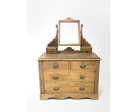 Edwardian pine dressing chest, raised back with swing mirror supported by shaped uprights, two trinket drawers, above two sho