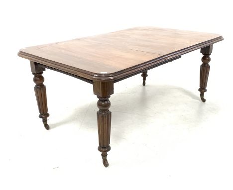 Victorian mahogany wind out extending dining table, rectangular moulded top raised on turned and reeded supports terminating 