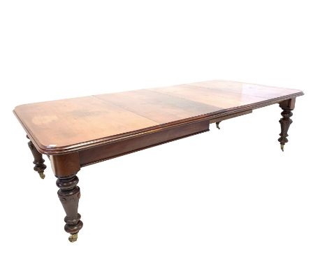 Large Victorian mahogany wind out extending dining table, the rectangular moulded top with rounded corners raised on turned c