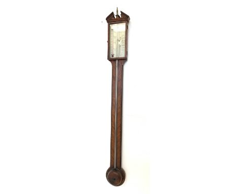 Georgian walnut stick barometer and thermometer, broken pediment with urn finial over quarter sawn veneered and boxwood and e