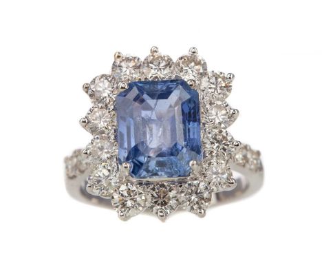 SAPPHIRE AND DIAMOND RING,the step cut sapphire of approximately 4.95 carats, within a diamond halo, on diamond shoulders tot