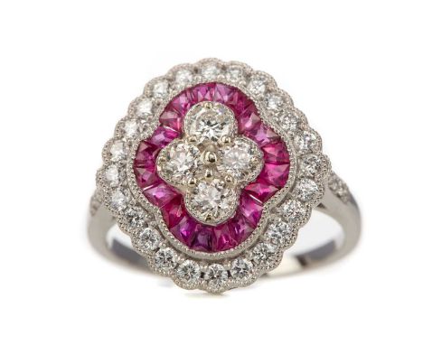 RUBY AND DIAMOND RING,set with calibre cut rubies and round brilliant cut diamonds totalling approximately 1.00 carat, unmark
