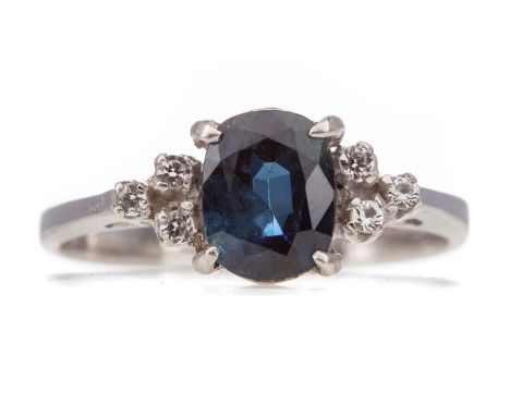 SAPPHIRE AND GEM SET RING,the oval sapphire flanked by round white gems, unmarked, size N, 2.5gStone 7.3x5.9x3.8mmGenerally w