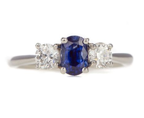 SAPPHIRE AND DIAMOND RING,the oval sapphire of approximately 0.82 carats, flanked by diamonds totalling approximately 0.57 ca