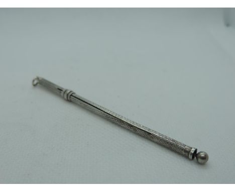 A Silver Swizzle Stick, engine turned, with a sliding swizzle. It is hallmarked for Birmingham 1991 by Deakin &amp; Francis, 