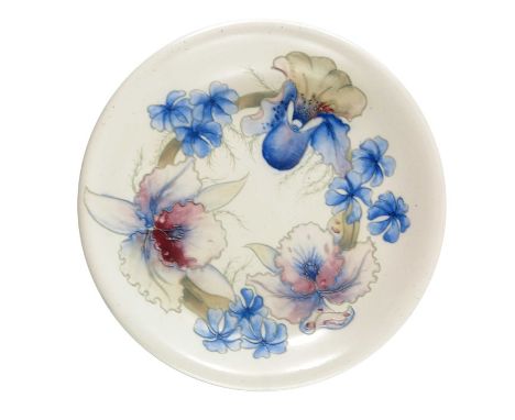 William Moorcroft, a slat glazed Orchid plate, circa 1930, white ground, with everted rim, impressed marks and facsimile sign