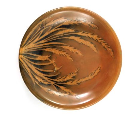 William Moorcroft, a matt glazed Waving Corn plate, circa 1935, orange ground with everted rim, impressed marks and facsimile