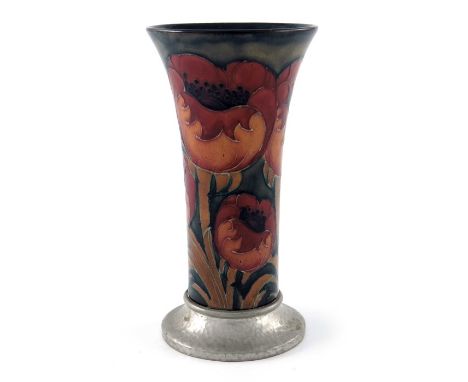 William Moorcroft for Liberty and Co., a Tudric pewter mounted Big Poppy vase, circa 1925, trumpet form with planished foot, 