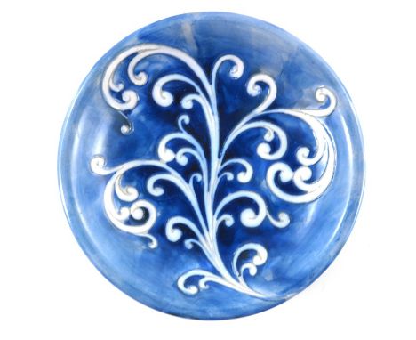 William Moorcroft, a matt glazed Fern plate, circa 1935, blue ground, impressed marks and underglaze blue monogram, 19cm diam
