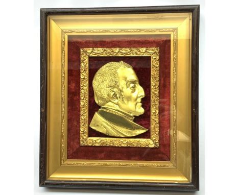 19th century gilt metal portrait plaque of Arthur Wellesley, 1st Duke of Wellington, looking to sinister, mounted on red velv
