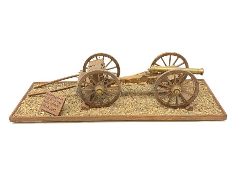 Wooden and brass scale model of a c1815 Napoleonic Field Gun with limber, brass barrel with ammunition boxes, on metal bound 