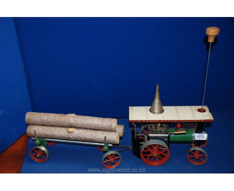 A Mamod Engine live Steam Tractor complete with spirit burner, wheel drive belt steering shaft and metal boiler filling funne