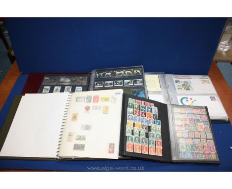 A box containing an Album of UK presentation packs and First Day Covers, Stamp Album from Malta, US, France, etc., Stock Book