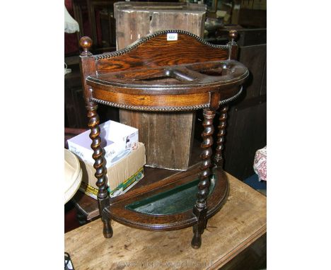 A 1940's Oak demi-lune, galleried back, barley twist leg Stick Stand