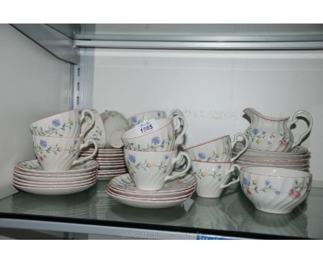 A Johnson Bros part Dinner service comprising ten each cups, saucers and tea plates, six cereal bowls, two mugs, milk jug and