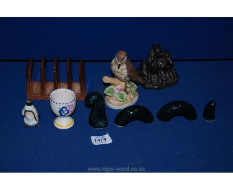 Miscellaneous china including Carlton ware toast rack, Poole egg cup, bird, Scottish pottery Loch Ness monster and two spanie