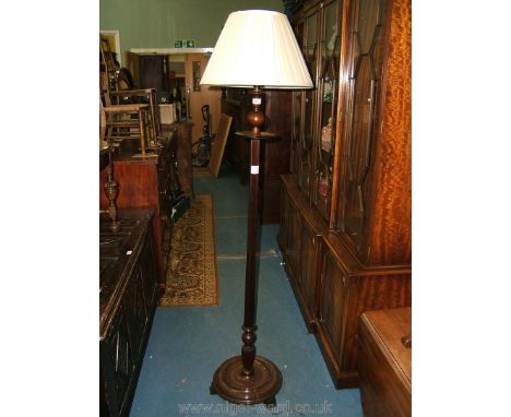 A 1930's Mahogany Regency style Standard Lamp having pleated and lined white tapering shade, the lamp with urn and ball turne