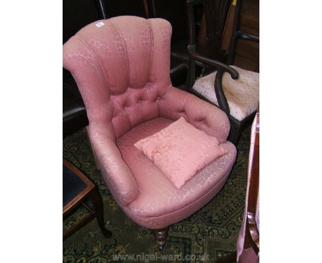 A 19th c. Parlour Armchair having button back and arms upholstered in pink floral shadow pattern fabric and standing on turne