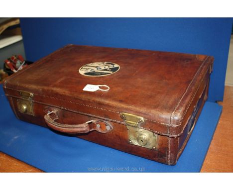 A leather and brass vintage suitcase, 24" x 15" x 7"