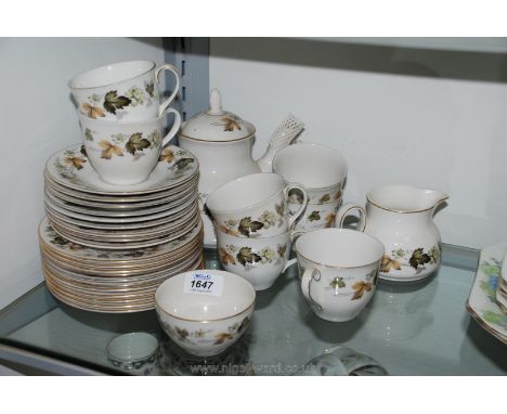 A Royal Doulton 'Larchmont' part Teaset including seven cups, nine saucers, eleven tea plates, teapot, milk jug and sugar bow