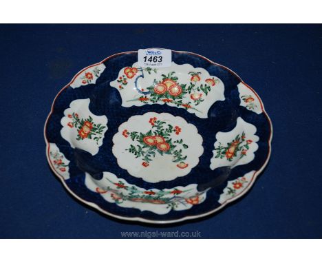 An 18th c. Royal Worcester lobed dished Plate in blue scale pattern with panels of hand painted  flowers and foliage with red