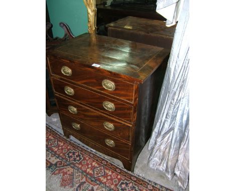 A 19th c. Mahogany Chest of four drawers of small proportions having rectangular flame Mahogany top with Boxwood string inlay