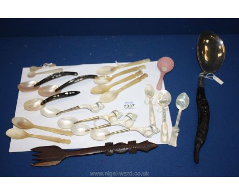 Six mother of pearl and other shell Spoons, black handled spoon, wooden fork, etc.