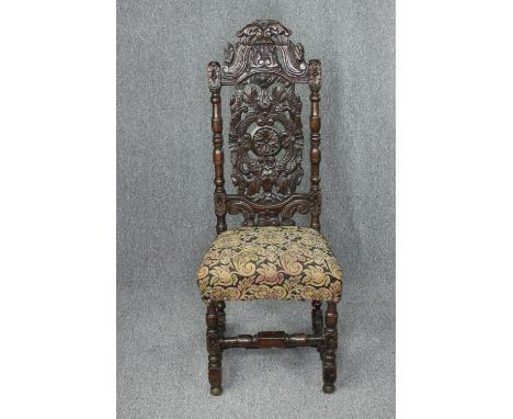 Side chair, 17th or 18th century carved oak with tapestry seat. H.128cm. 