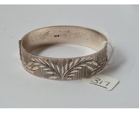 A silver bangle - 36gms