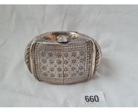 A massive hinged foreign silver bangle 2 1/2 inches wide 490 gms